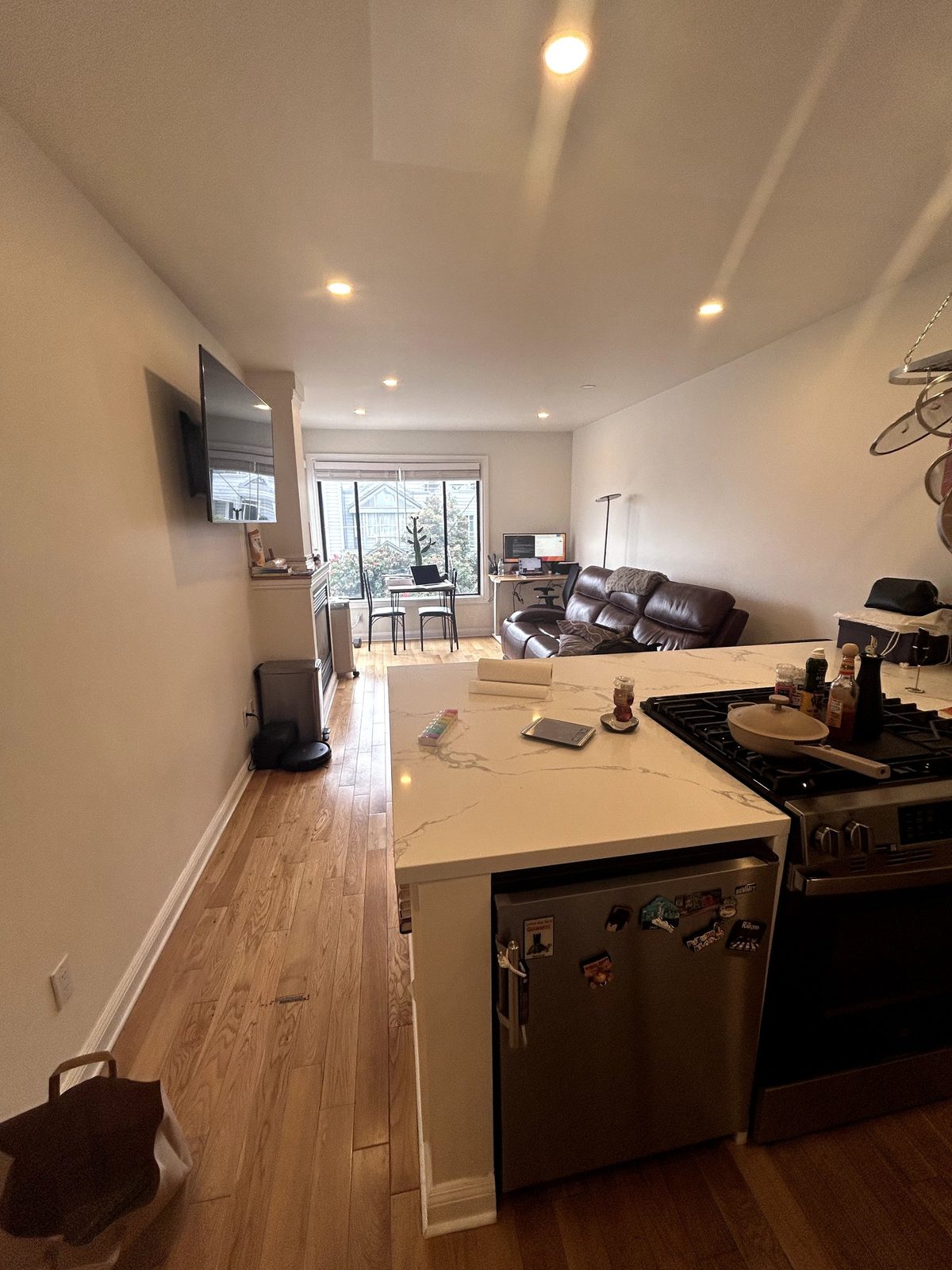 Dim kitchen with clutter on the counters